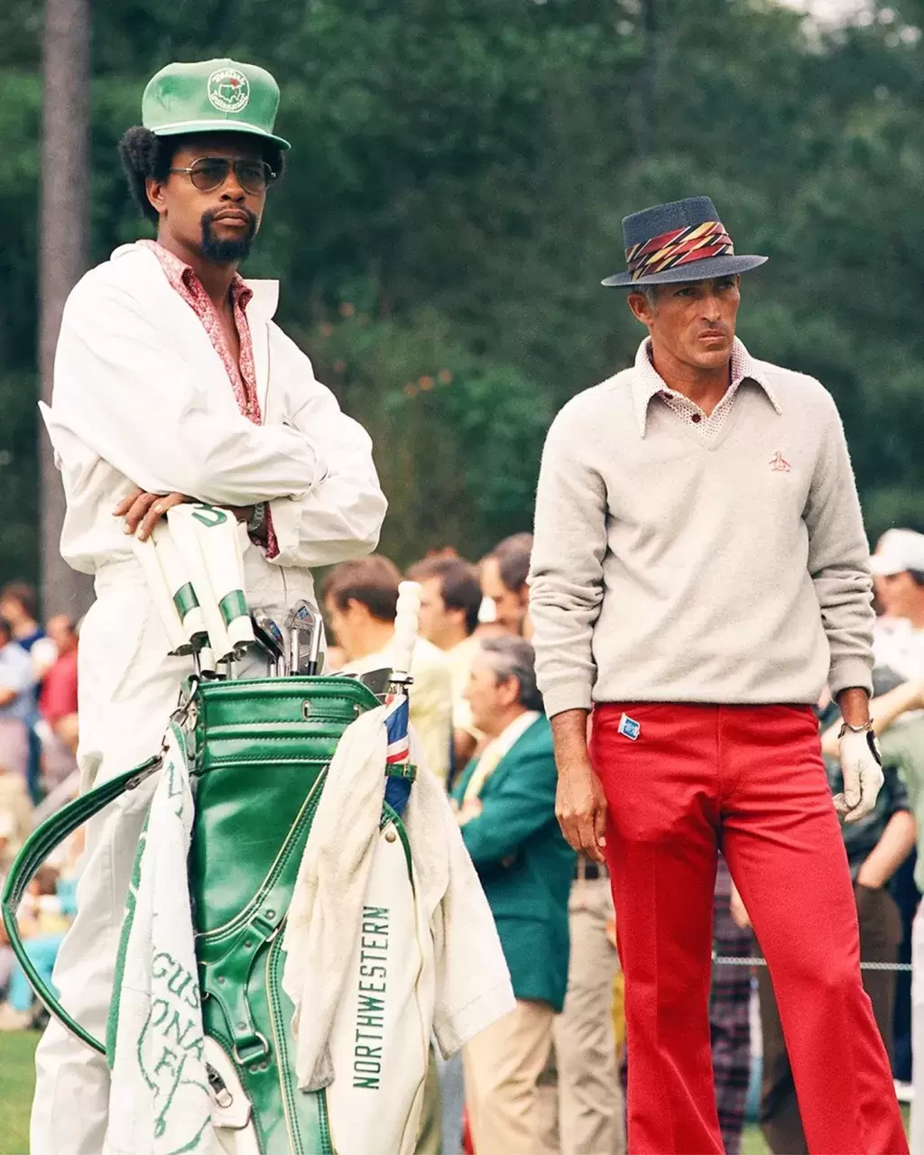 Chi Chi Rodriguez walks and swings