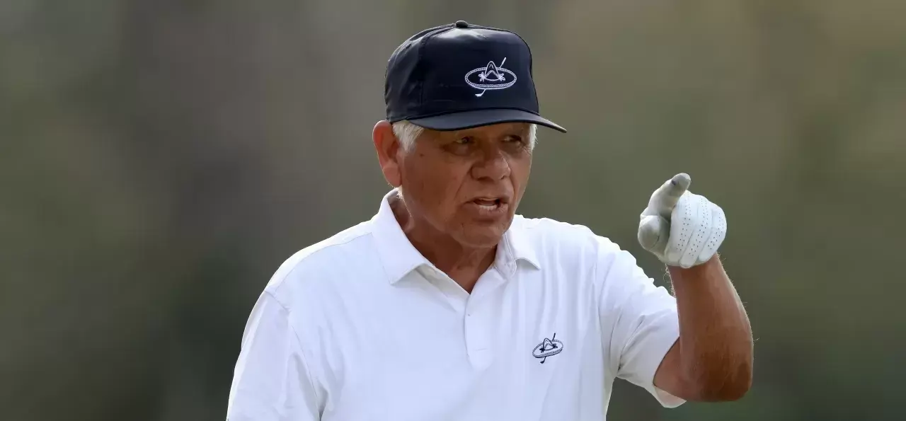 Lee Trevino points on the 14th hole during the first round of the PNC Championship at the Ritz Carlton Golf Club Grande Lakes on December 18