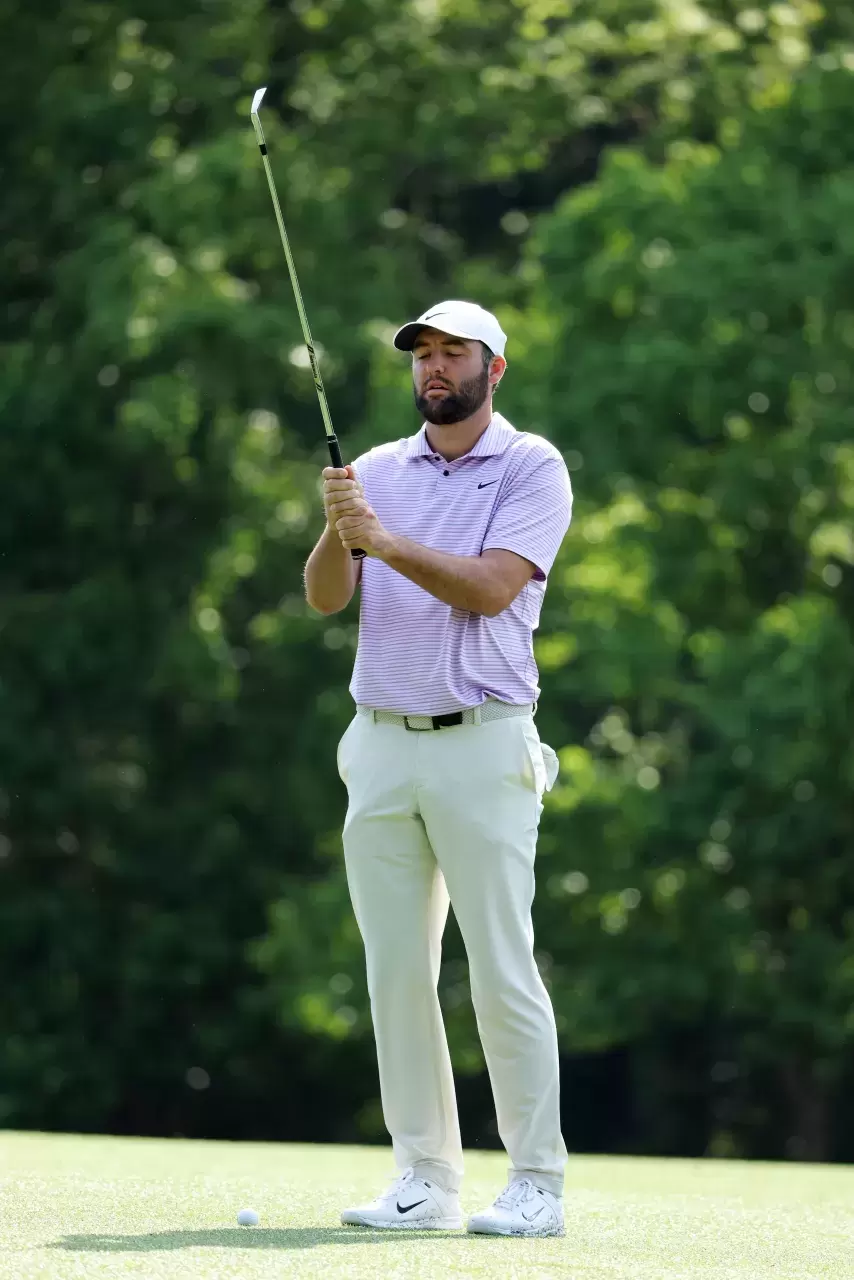 Scottie Scheffler of the United States reacts on the 11th hole during a practice round prior to the 2024 Masters Tournament 