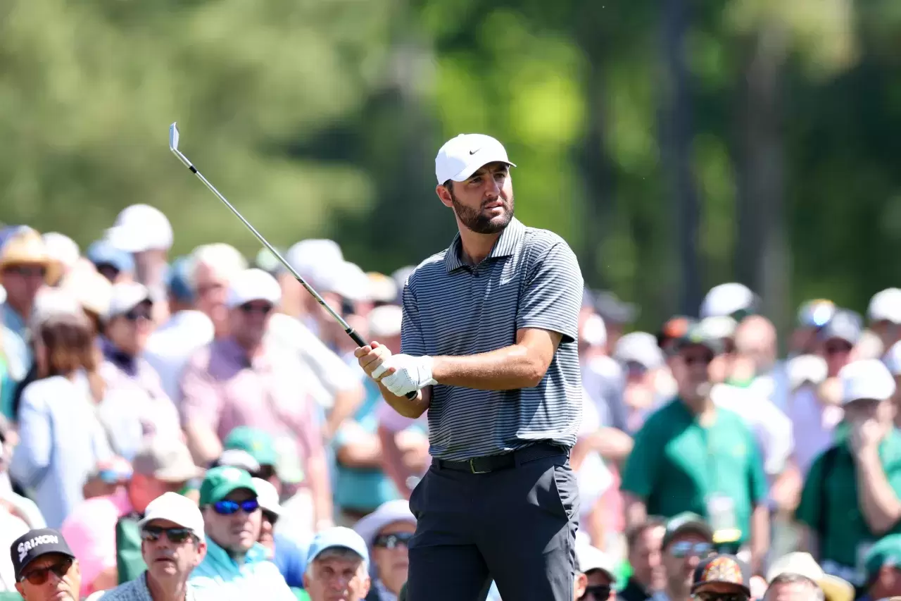 Scottie Scheffler of the United States reacts on the 11th hole during a practice round prior to the 2024 Masters Tournament