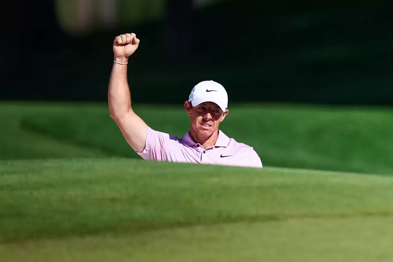 Rory McIlroy of Northern Ireland reacts after holing-out for eagle from a greenside bunker on the 15th hole during the final round of the Wells Fargo Championship at Quail Hollow Club on May 12, 2024 in Clifton, North Carolina