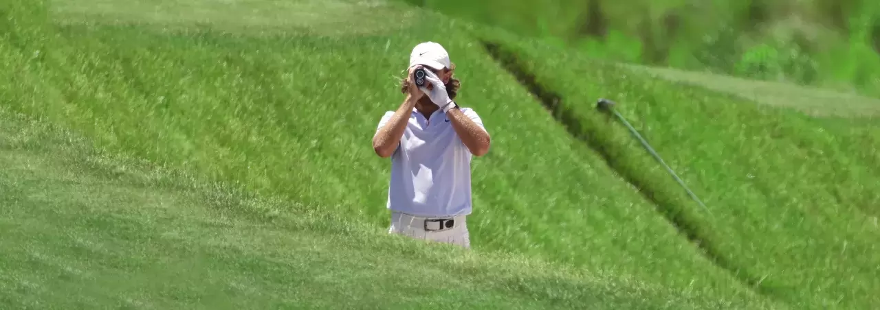Tommy Fleetwood of England uses a rangefinder on PGA Championship at Kiawah Island Resort Ocean