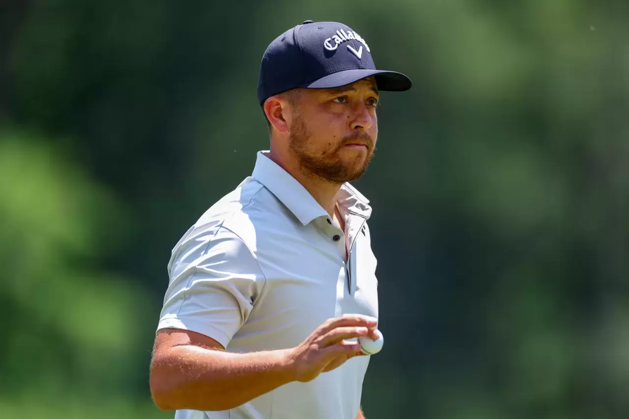 Xander Schauffele reacts after making a par on the second hole during the third round of the Wells Fargo Championship at Quail Hollow Country Club