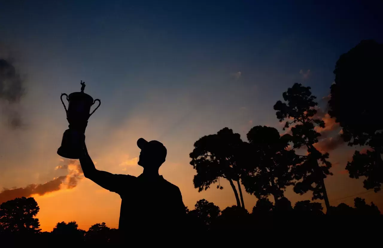 Martin Kaymer of Germany celebrates with the trophy after his eight-stroke victory during the final round of the 114th U.S. Open at Pinehurst Resort & Country Club, Course No. 2 on June 15, 2014 in Pinehurst