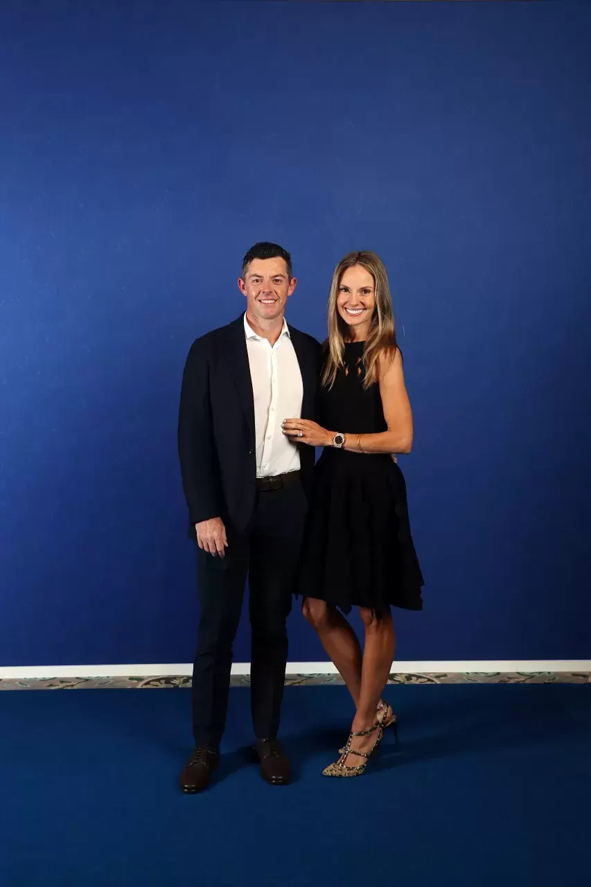 Rory McIlroy of Northern Ireland and team Europe and wife Erica Stoll pose for a photo during the Team Europe Gala Dinner prior to the 43rd Ryder Cup at The American Club on 
