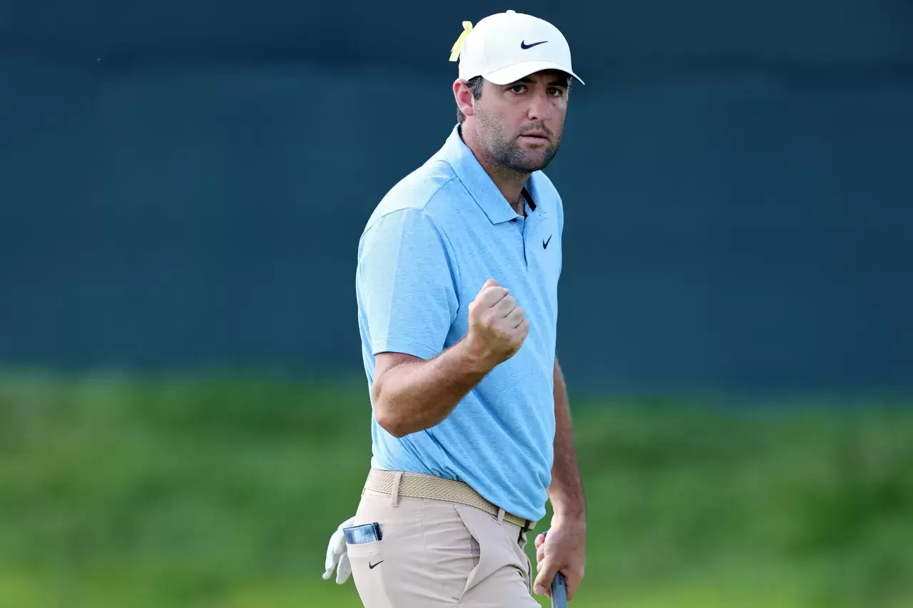 Scottie Scheffler of the United States reacts after making par on the 16th green during the final round of the Memorial Tournament presented by Workday at Muirfield Village Golf Club on June 09, 2024 in Dublin, Ohio