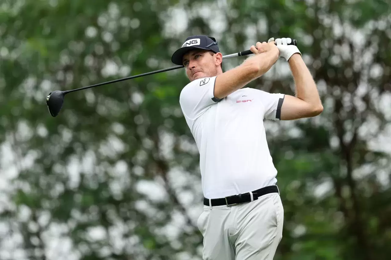 Joel Girrbach of Switzerland plays a shot during Day Two of the Hainan Open at Danzhou Ancient Saltern Golf Club on October 14, 2023 in Hainan Island, China