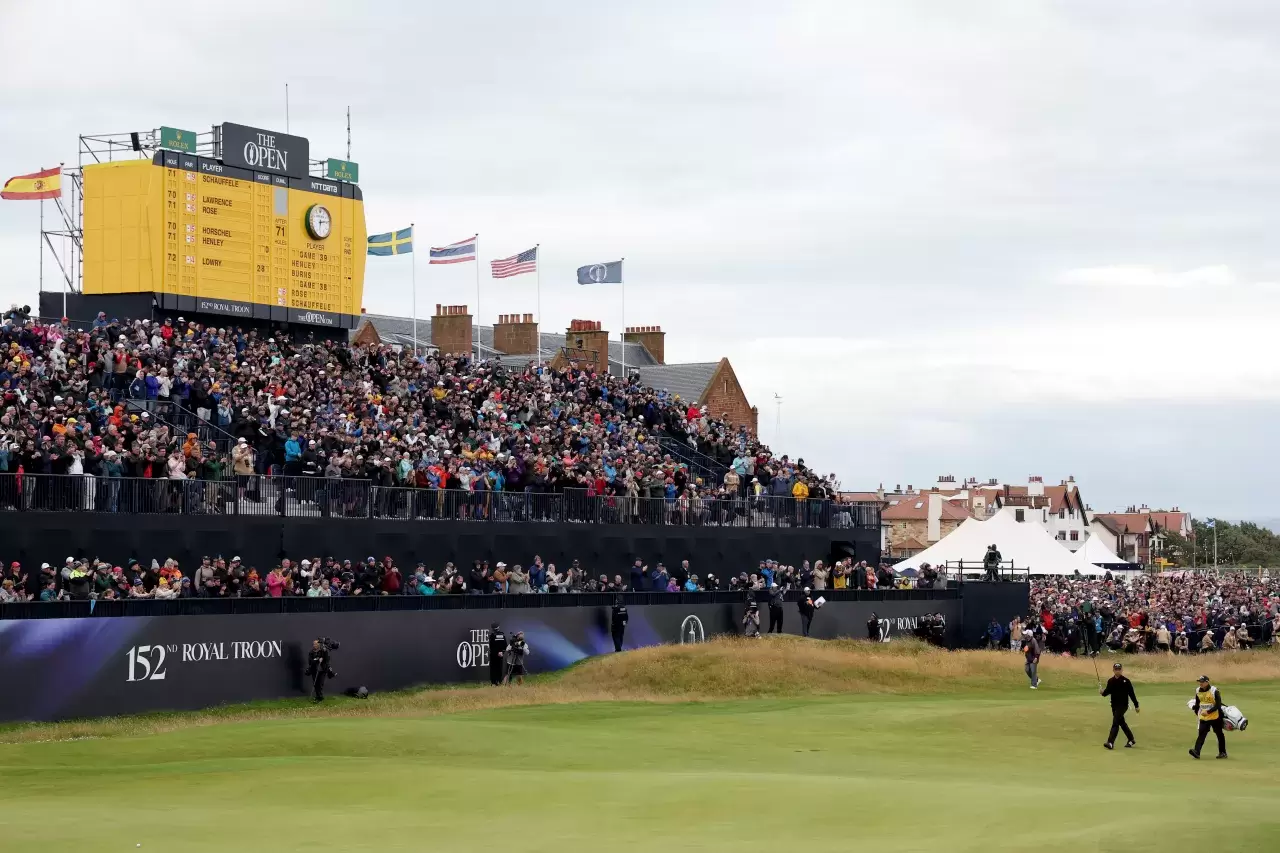 A general view of the 18th green as Xander Schauffele of the United States acknowledges the crowd as he walks on the 18th green during day four of The 152nd Open championship at Royal Troon on July 21, 2024 in Troon, Scotland