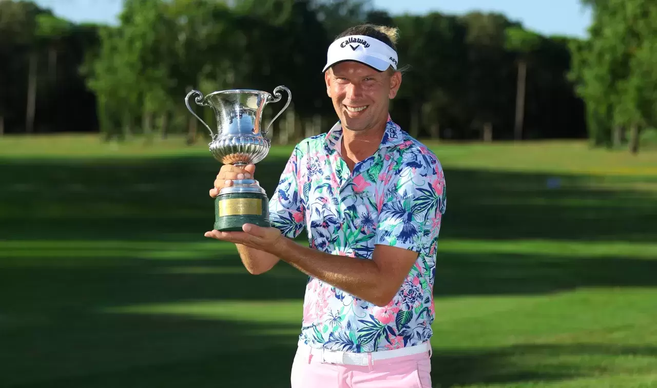 Marcel Siem of Germany poses with the trophy after winning the Italian Open presented by Regione Emilia-Romagna Heritage Golf Club Mauritius