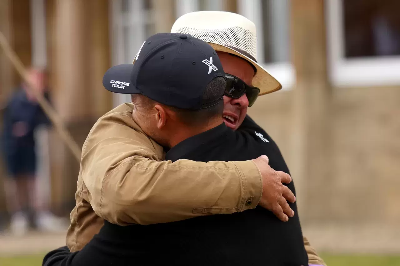 Xander Schauffele of the United States celebrates with his father, Stefan Schauffele after winning during day four of The 152nd Open championship at Royal Troon on July 21, 2024 in Troon, Scotland