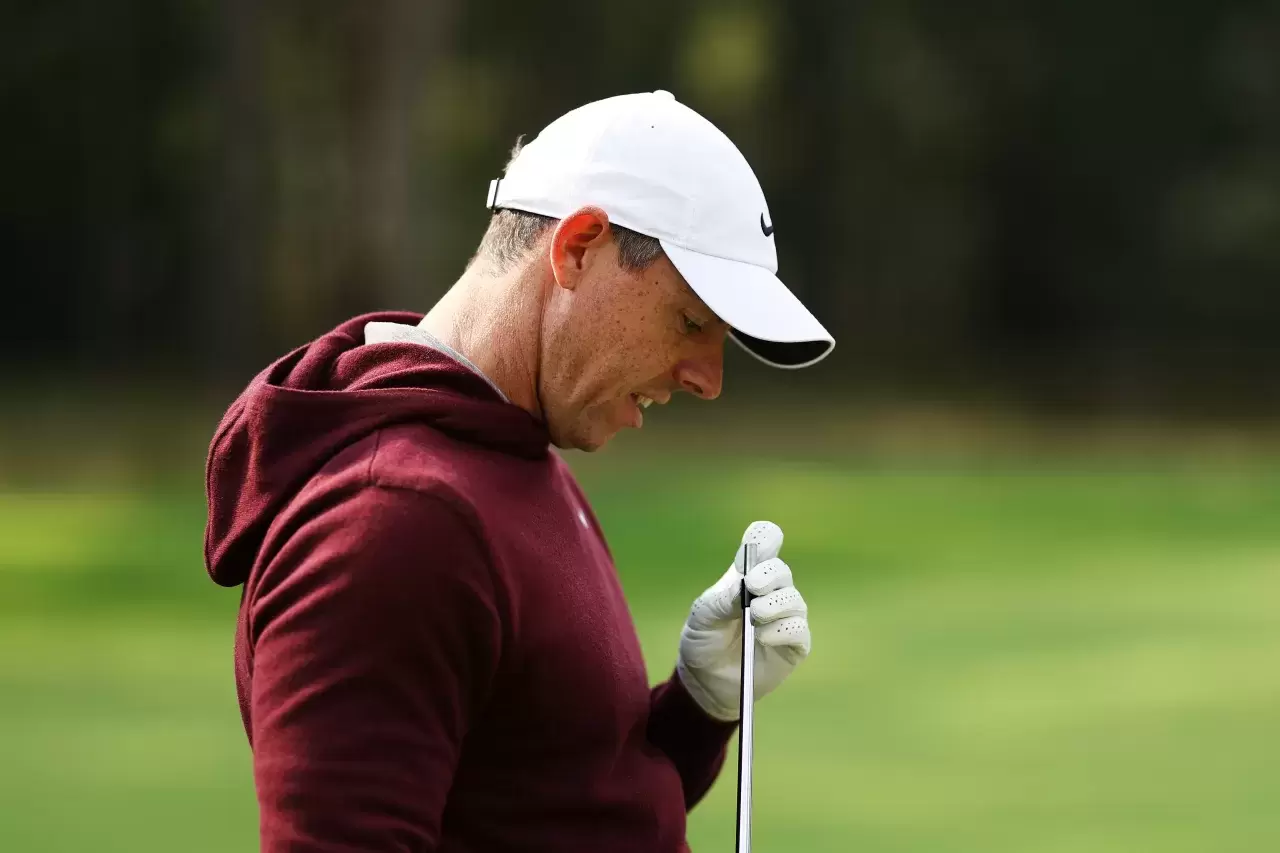 Rory McIlroy of Northern Ireland inspects his club, after breaking it on the 12th hole during day one of the BMW PGA Championship 2024 at Wentworth Club on September 19, 2024 in Virginia Water, England