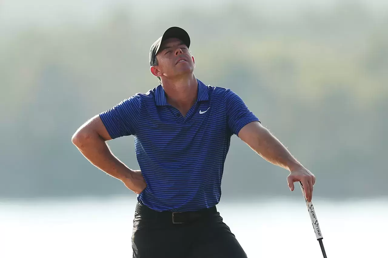 Rory McIlroy of Northern Ireland reacts to a missed putt on the 18th green on day three of the Abu Dhabi HSBC Championship 2024