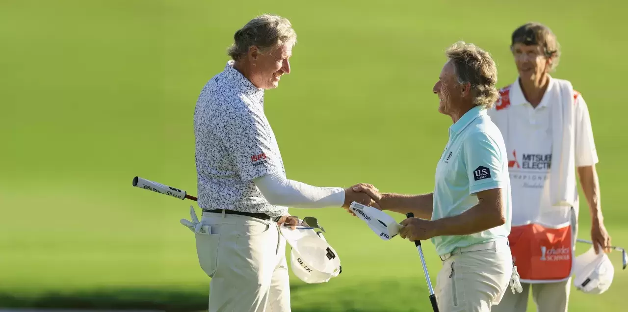 Ernie Els of South Africa is congratulated by Bernhard Langer of Germany after winning the Mitsubishi Electric Championship at Hualalai at Hualalai Golf 