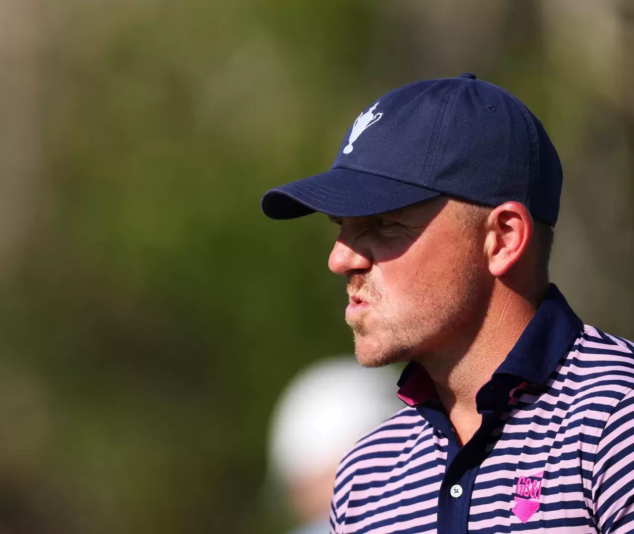 Matt Wallace of Team Great Britain & Ireland reacts on the 10th hole during the foursomes matches on day two of the Team Cup at Abu Dhabi Golf Resort