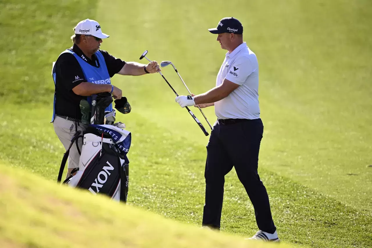 Sepp Straka of Austria and his caddie Duane Bock prepare to putt on the 12th hole during the final round of The American Express 2025