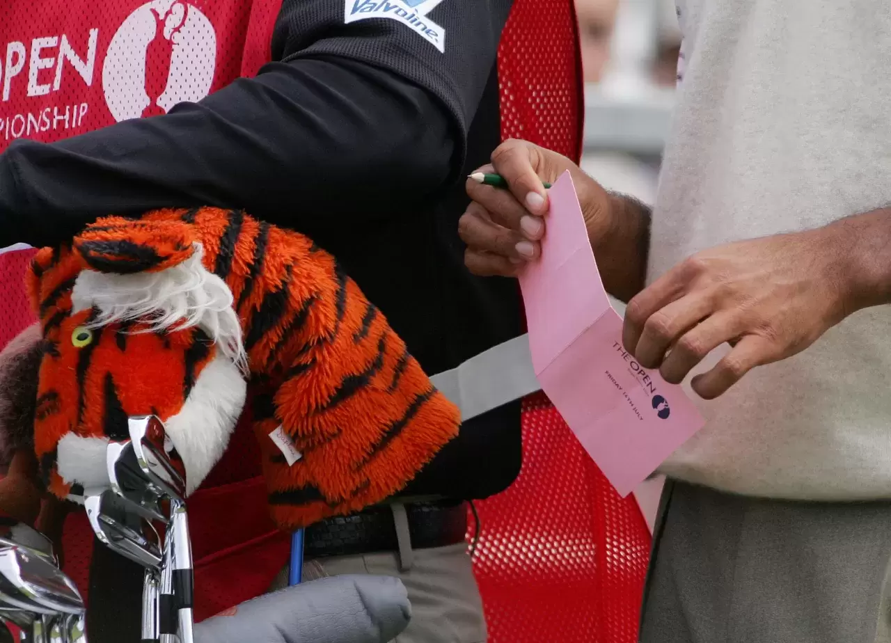 Tiger Woods of the US holds his score card as he waits to tee off on the 16th hole during the second round of the 133rd Open Championship