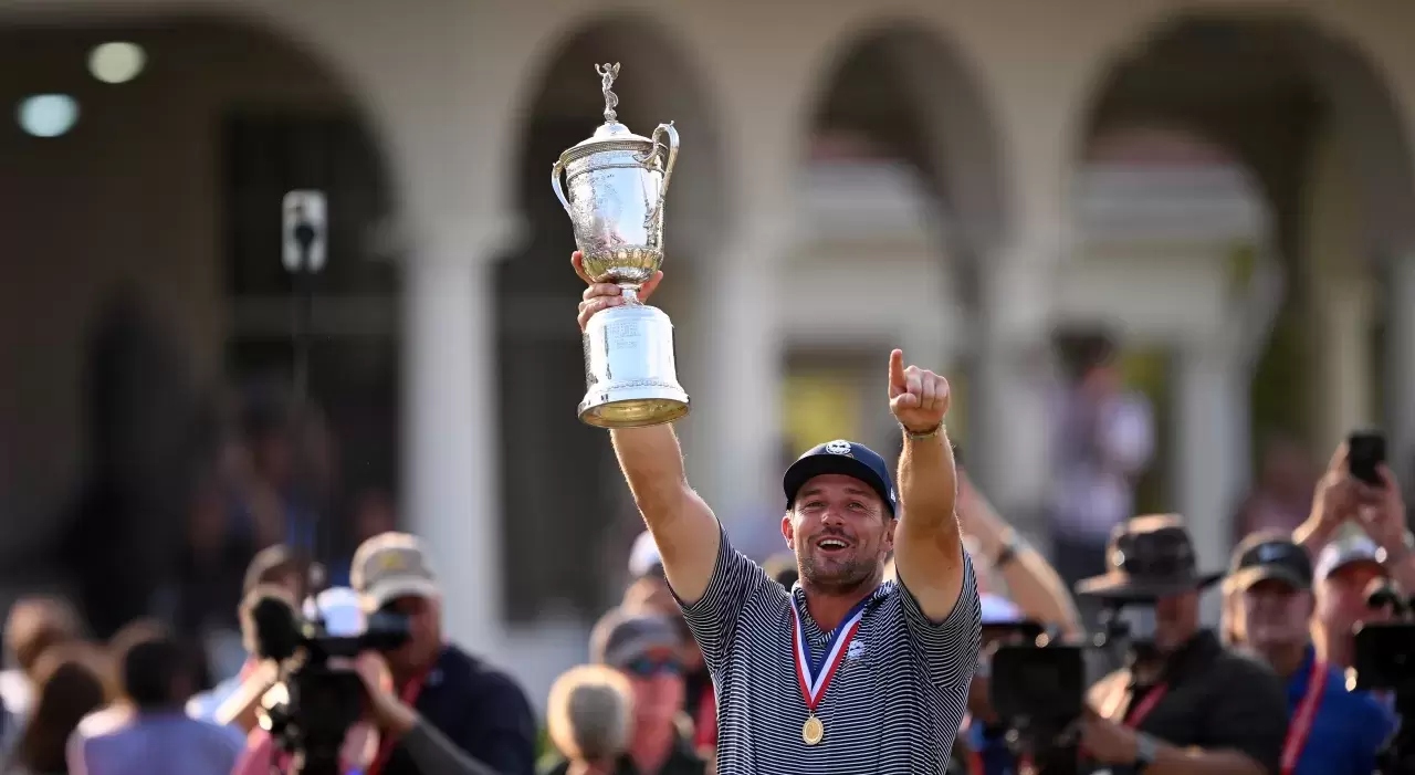 Bryson DeChambeau of the United States poses with the trophy after winning the 124th U.S. Open at Pinehurst Resort