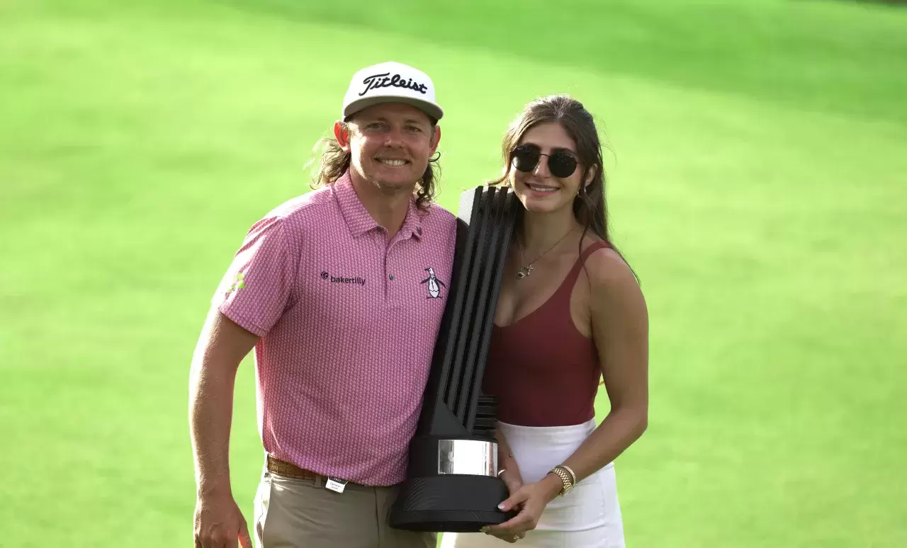 Cameron Smith and Shanel Naoum celebrate victory following day three of the LIV Golf League at the Centurion Club