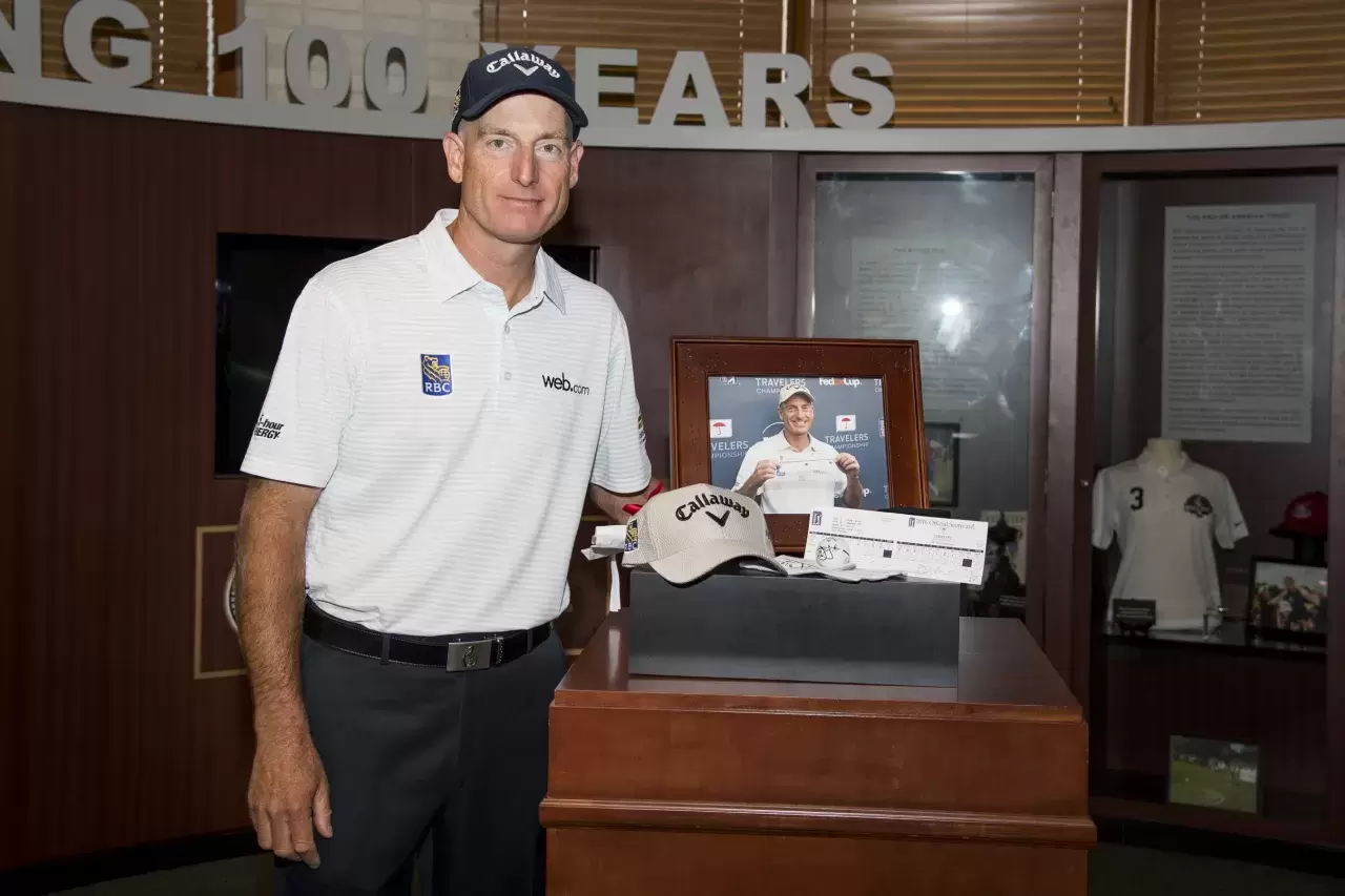 Jim Furyk presents his record-setting scorecard from his final round at the Travelers Championship to the World Golf Hall of Fame Photo by Ryan Young-PGA TOUR