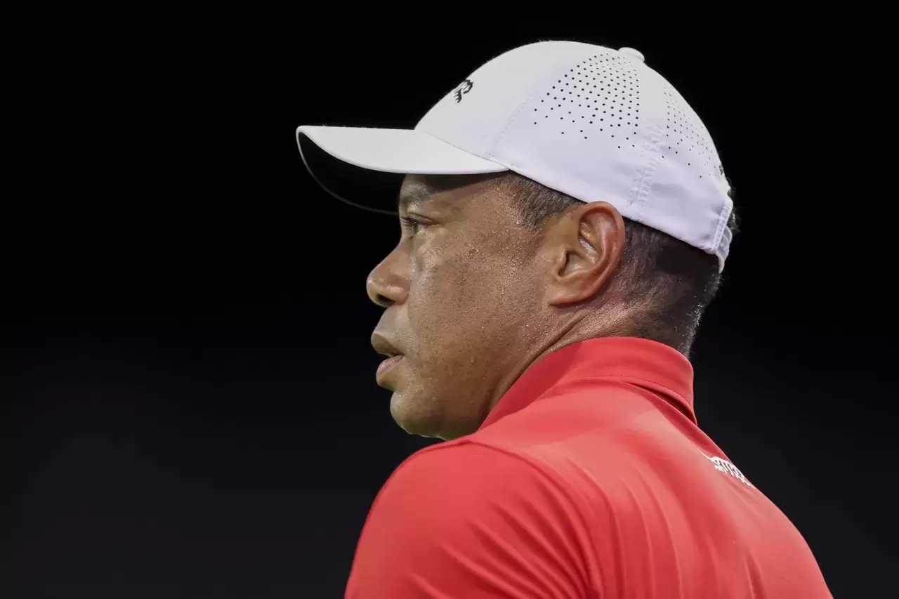 Tiger Woods of Jupiter Links Golf Club looks on while warming up before their TGL presented by SoFi match against New York Golf Club at SoFi Center o