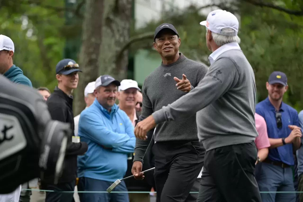 Tiger Woods talks Fred Couples Masters Tournament Augusta National Golf Club Georgia Pho-to by Ben Jared PGA TOUR via Getty Images