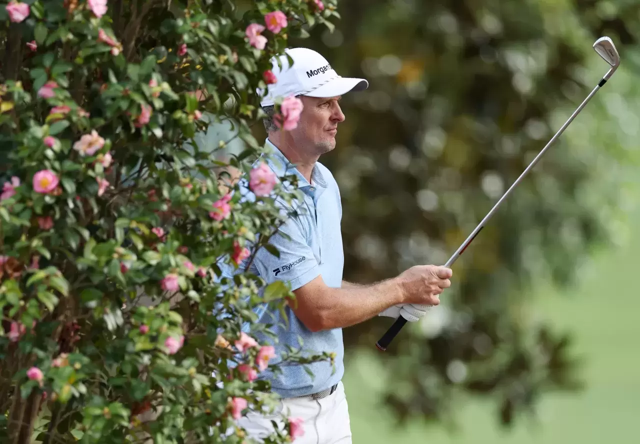 Justin Rose of England plays his second shot on the 18th hole during the first round of the 2025 Masters Tournament at Augusta National