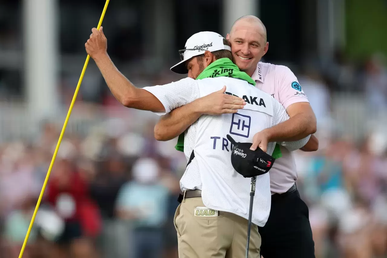 Sepp Straka of Austria reacts with his caddie Drew Mathers after putting in to win on the 18th green during the final round of the Truist Championship 2025 at The Wissahickon at Philadelphia