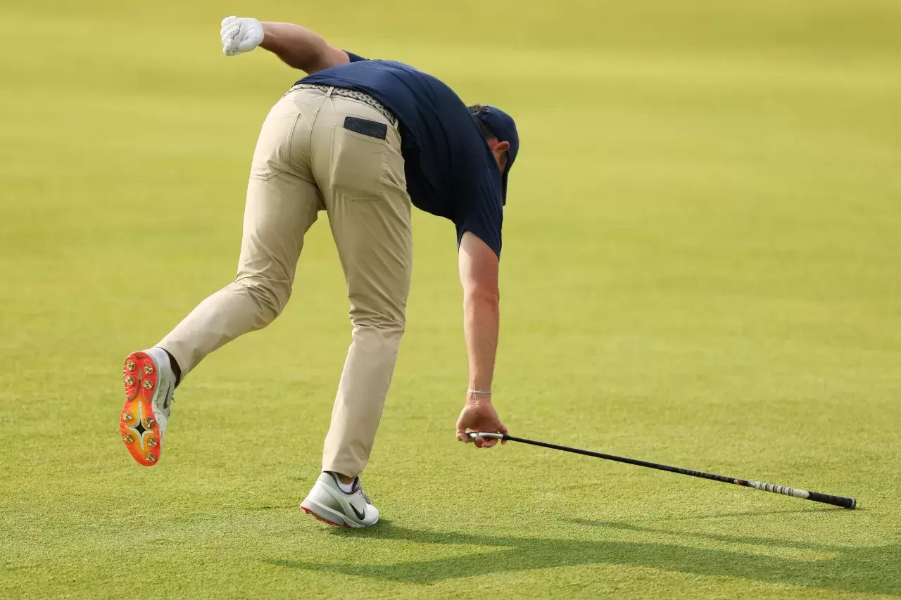 Rory McIlroy of Northern Ireland picks up his club after throwing it as he walks the 12th hole during the second round of the 125th US OPEN at Oakmont Country Club on June 13 2025 in Oakmont Pennsylvania