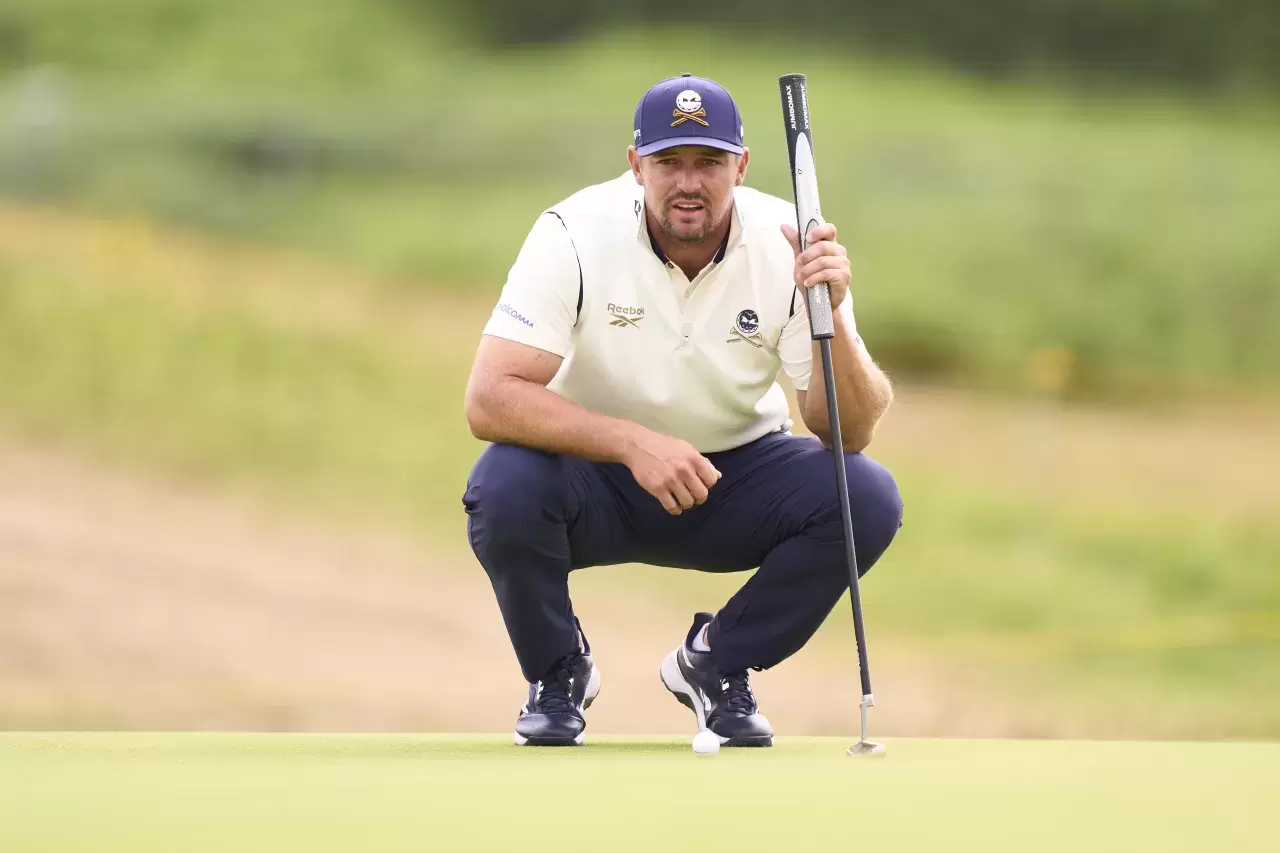 Bryson DeChambeau of United States studies his shot on the 12th hole during day three of The 153rd Open Championship at Royal Portrush Golf Club on July 19, 2025 in Portrush, Northern Ireland