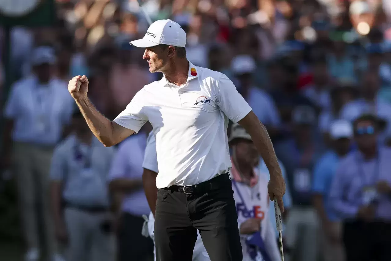 Justin Rose of England reacts after making a birdie on the 18th hole during a playoff against J.J. Spaun during the final round of the FedEx St. Jude Championship