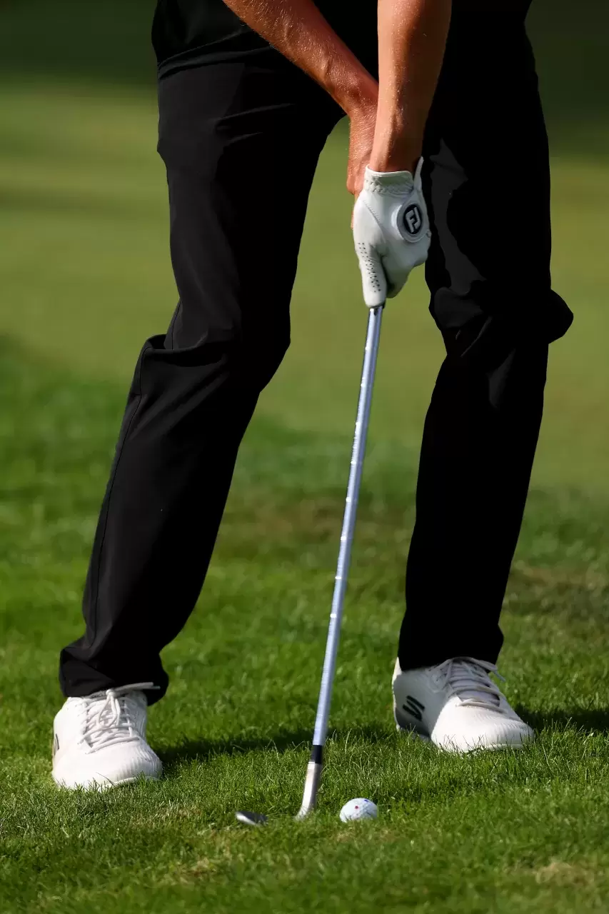 A detail view of the cross handed chip grip of Matt Fitzpatrick of England