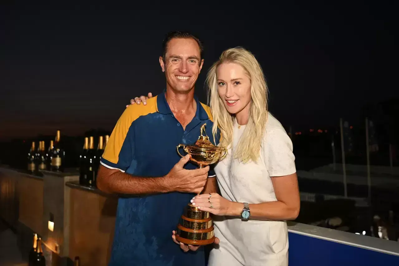 Nicolas Colsaerts, Vice Captain of Team Europe poses for a photograph with the Ryder Cup trophy alongside wife Rachel Colsaerts following the Sunday singles matches of the 2023 Ryder Cup at Marco Simone Golf Club on October 01, 2023 in Rome