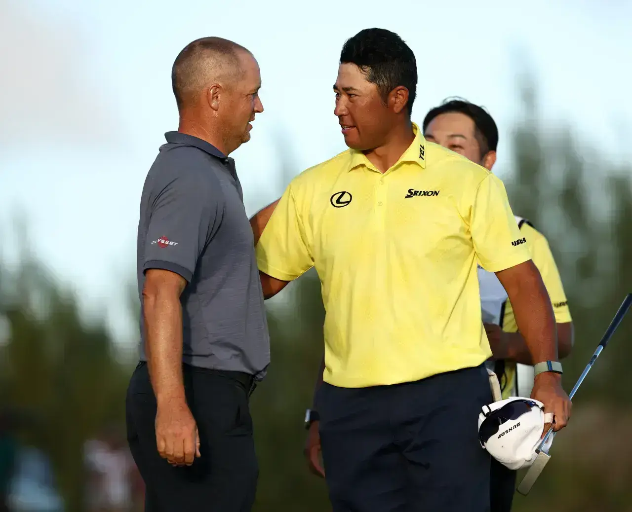 Alex Noren Hideki Matsuyama the 18th green after his win in a playoff during the final round of the Hero World Challenge 2025 Albany Golf Course December 2025 in Nassau Bahamas
