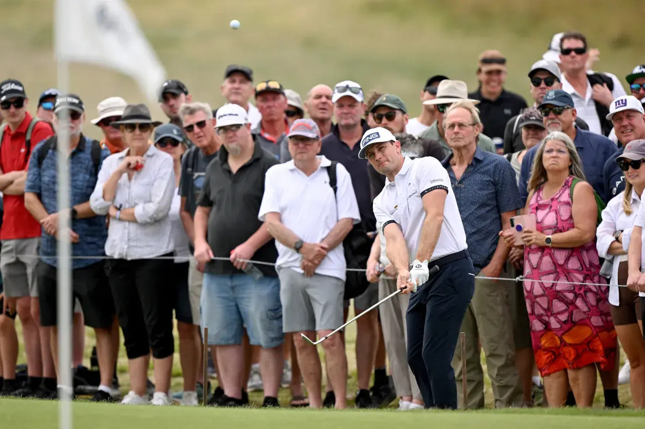 Joel Girrbach chips onto the green during the first round of the Australian Open golf tournament at the Royal Melbourne Golf Club in Melbourne.