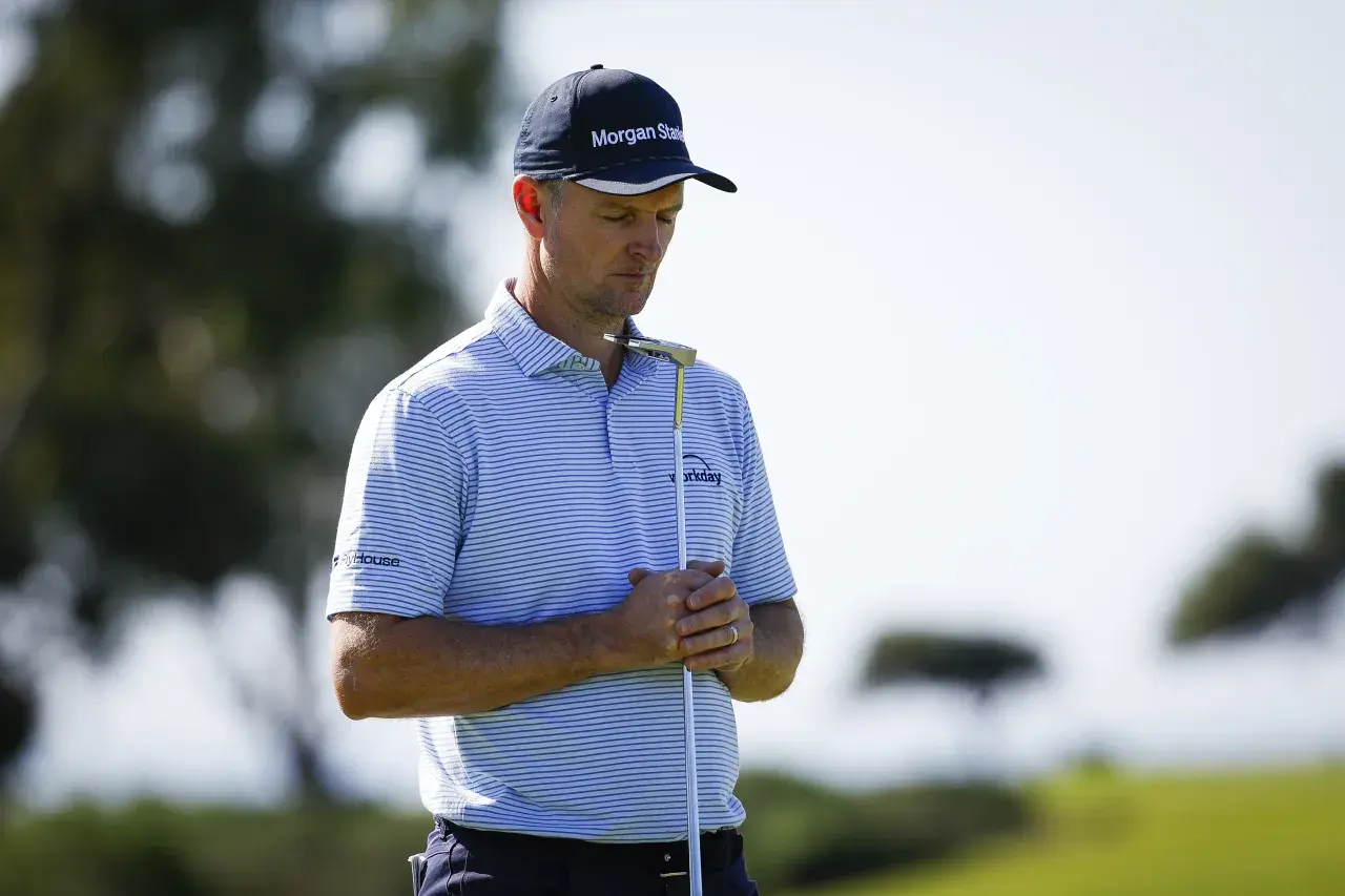 Justin Rose pauses before putting on the green of the sixth hole during the third round of the Farmers Insurance Open at Torrey Pines South Course on Saturday