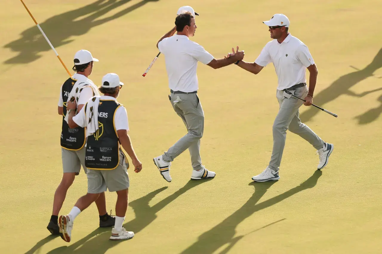 Corey Conners of Canada and the International Team reacts with Nick Taylor of Canada International 18th Saturday Foursome matches Presidents Cup 2026 Medinah Country Club
